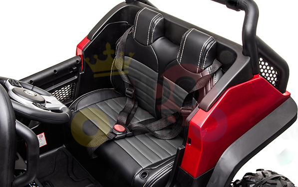 The Pink 12V/4X4 Official Mercedes Unimog Junior Ride On UTV features two black leather-look seats with white stitching and safety harnesses. Its red-black frame includes a dashboard, steering wheel, and roll bar. A remote control offers added fun and convenience!.