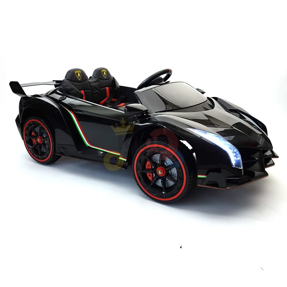 The Black 2X12V Limited Edition 4WD Lamborghini Veneno Ride-on Car, RC is a sleek toy with LED headlights, emblem-adorned seats, red accents, race-inspired rear wing, and sporty wheels. Enjoy the 2-seater experience complete with a parental remote control.