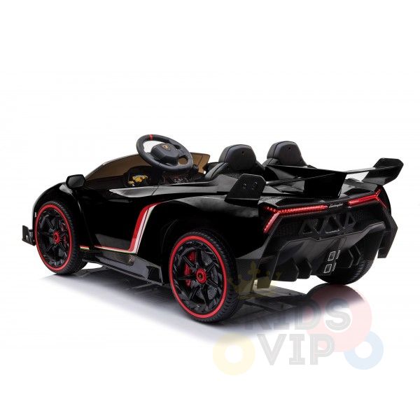The Black 2X12V Limited Edition 4WD Lamborghini Veneno Ride on Car, RC, is a sleek, sporty black kids car with red accents and racing stripes. It features a detailed steering wheel, visible rear lights, and a parental remote control for safety—a perfect ride for young racers.