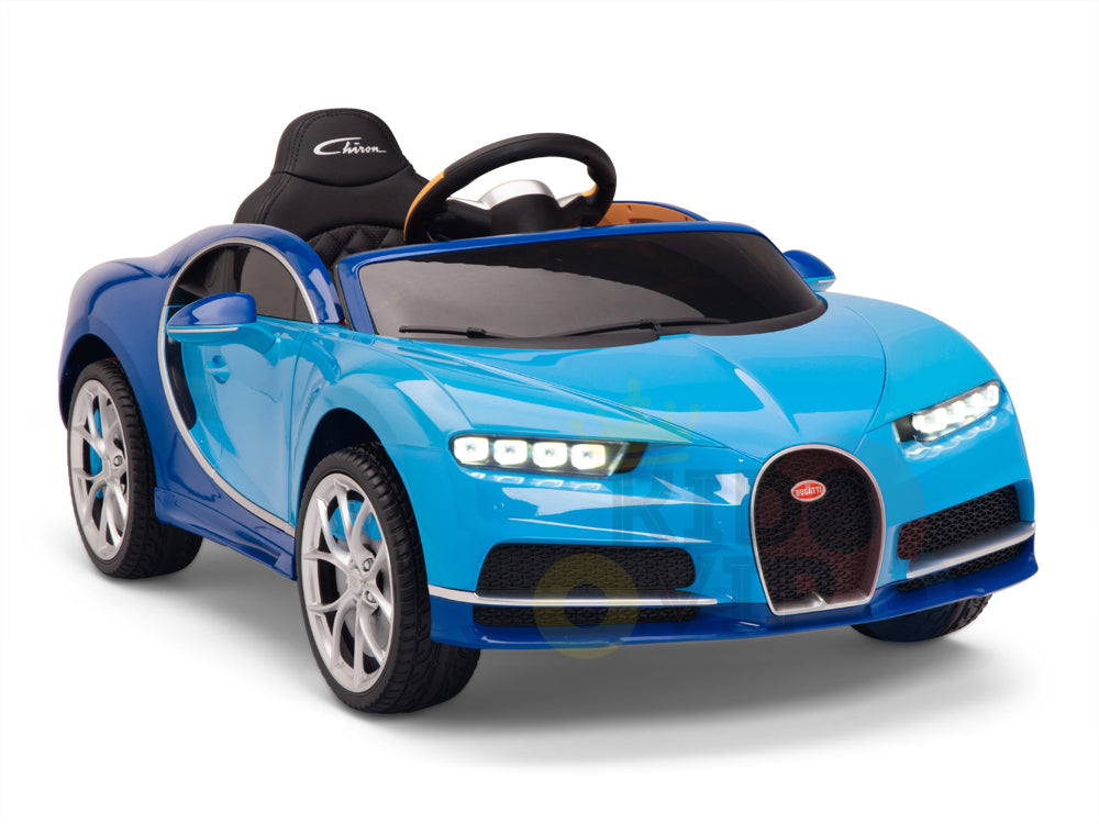 The Blue 12V Bugatti Chiron Kids Licensed 1 Seater Ride On Car features realistic rubber wheels, detailed headlights, and a black steering wheel. This toy electric car resembles a luxury sports car and comes with a remote control for added fun, making it appealing to young children.