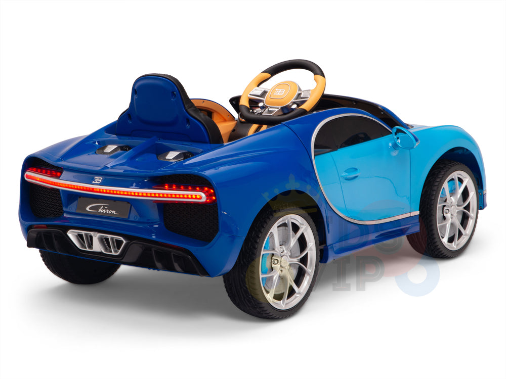 The Blue 12V Bugatti Chiron Kids Licensed 1 Seater Ride On Car features detailed luxury sports car bodywork, a steering wheel, red taillights, and rubber wheels. It includes a remote control option to offer young drivers an exciting experience.