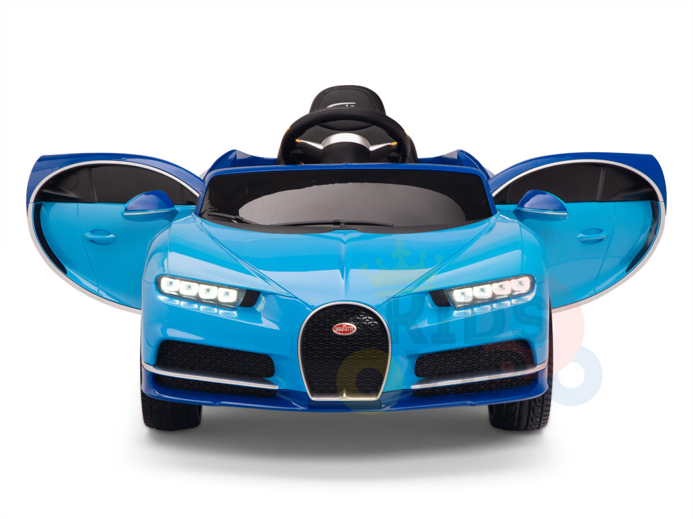 The Blue 12V Bugatti Chiron Kids Licensed 1 Seater Ride On Car showcases open doors, a black grille with logo, LED-style lights, and rubber wheels. This remote-controlled gem includes a toy steering wheel and captures the essence of sporty brilliance.