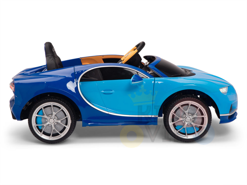 The Blue 12V Bugatti Chiron Kids Licensed 1 Seater Ride On Car boasts silver rims, a black seat, and rubber wheels. Its sleek design, shiny finish, and aerodynamic curves make it resemble a luxury sports model.