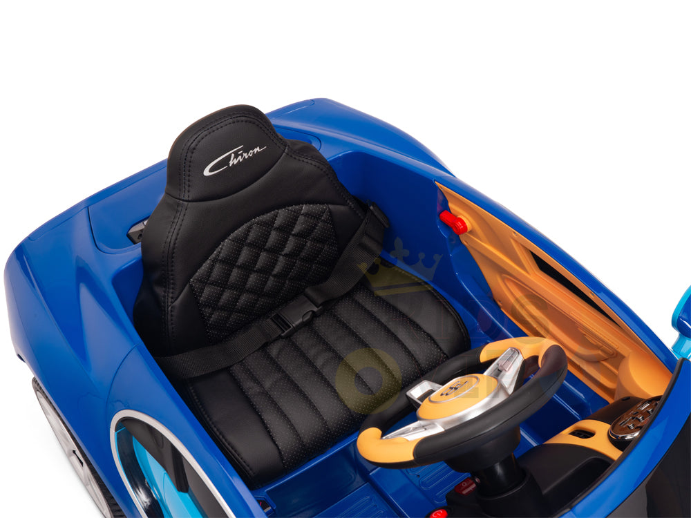 The Blue 12V Bugatti Chiron Kids Licensed 1 Seater Ride-On Car features a black cushioned toy seat with racing harness, a small black steering wheel with metallic trim and buttons, yellow and blue door panels, rubber wheels for smooth rides, and a logo on the headrest.