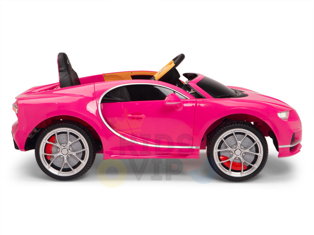 The Pink 12V Bugatti Chiron Kids Licensed 1 Seater Ride-On Car sports silver rubber wheels, black seats, and a yellow interior. Its design includes a steering wheel and visible side mirrors, set against a white background.