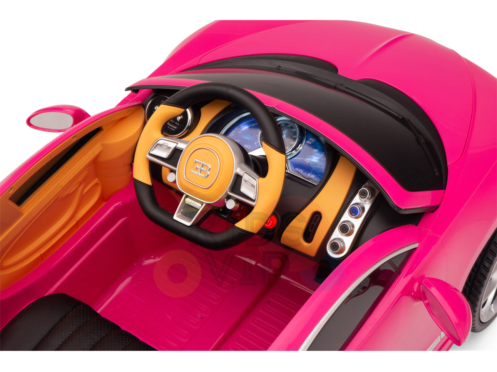 The Pink 12V Bugatti Chiron Kids Licensed 1 Seater Ride On Car features a black steering wheel with a yellow center, authentic dashboard gauges, vibrant yellow and pink interior accents, detailed doors, and rubber wheels for a smooth ride, making it ideal for little racers.
