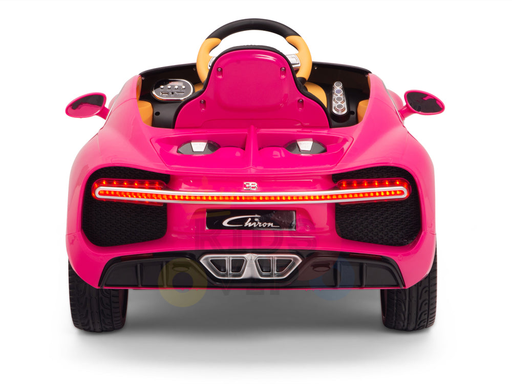 The Pink 12V Bugatti Chiron Kids Ride On Car features a sports car design with rubber wheels, LED-style tail lights, a small steering wheel, and detailed dashboard. It resembles a luxury Bugatti Chiron and has the license plate Chiron.