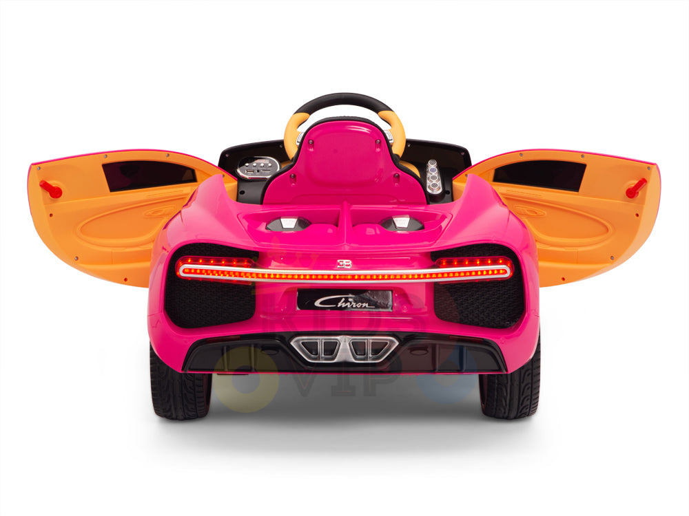 The Pink 12V Bugatti Chiron Kids Ride-On Car, inspired by the original, features rubber wheels, rear view with openable doors, detailed taillights, dual exhausts, a steering wheel, and a Chiron license plate. Perfect for little car enthusiasts.
