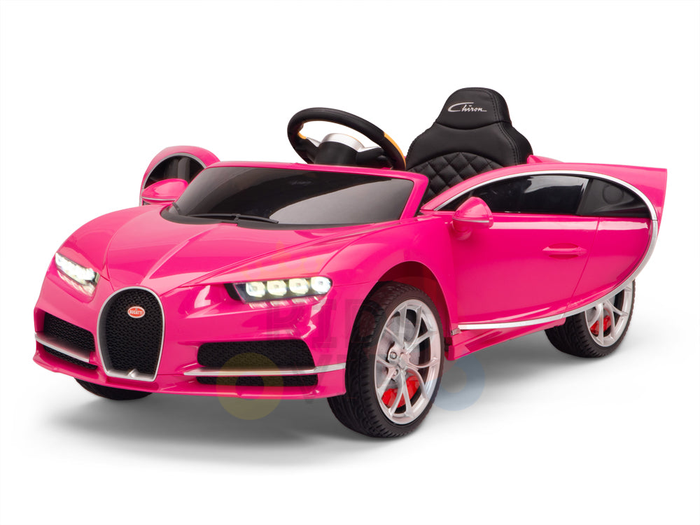 This Pink 12V Bugatti Chiron Kids Licensed 1 Seater Ride On Car resembles a luxury sports car, featuring sleek design, detailed headlights, a black steering wheel, rubber wheels for smooth rides, an open drivers side door, and comes with a remote control for ultimate driving fun.