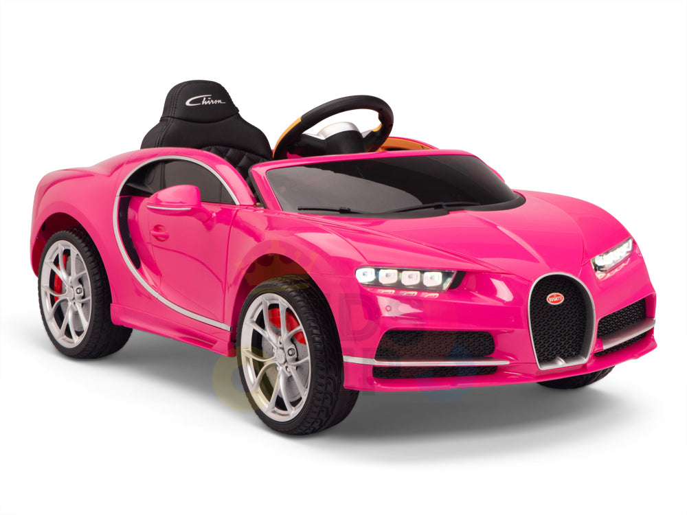 The Pink 12V Bugatti Chiron Kids Licensed 1 Seater Ride On Car features luxury sports car design, inspired by the Bugatti Chiron, with a realistic black seat, steering wheel, headlights, rims, and sleek curves for a sporty look. It comes equipped with rubber wheels for smooth riding and a remote.