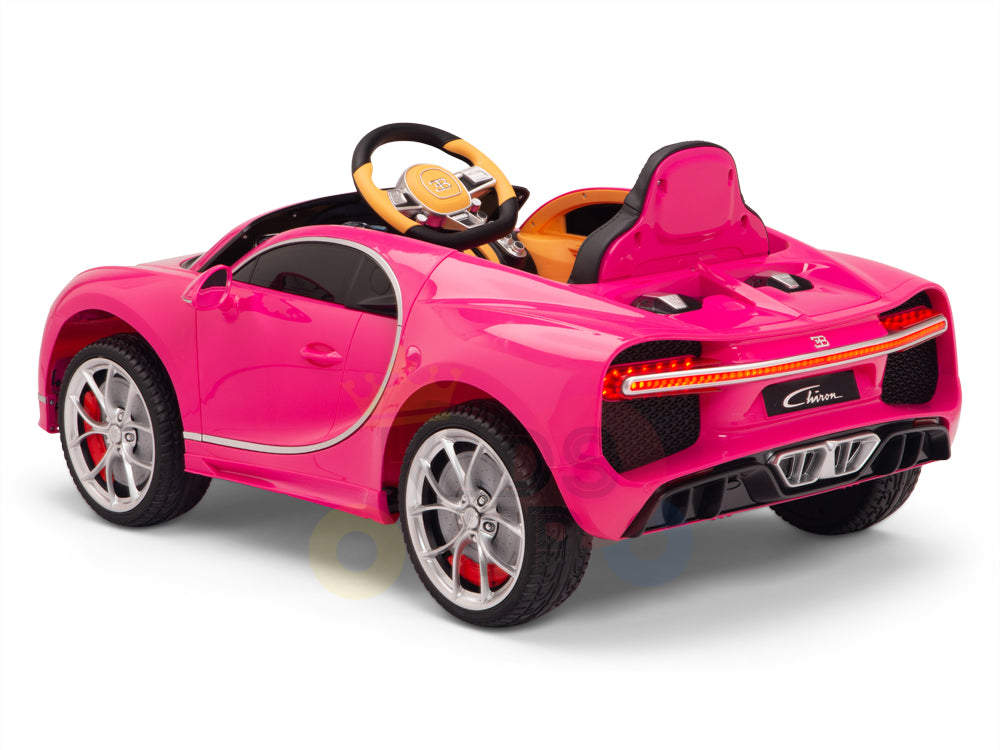 A Pink 12V Bugatti Chiron Kids Licensed Ride-On Car features rubber wheels, a steering wheel, rear spoiler, red and black detailing with silver wheels against a white background.