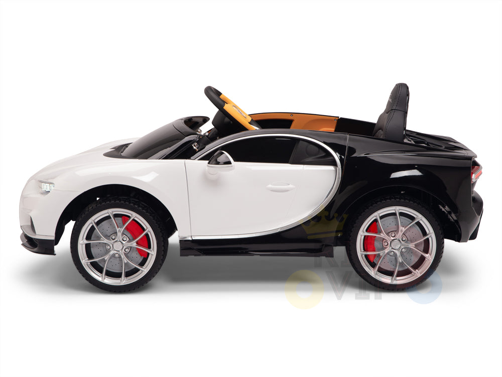The White 12V Bugatti Chiron Kids Ride On Car with Rubber Wheels and Remote is a licensed, sporty, black-and-white convertible featuring red brake calipers, silver wheels, a visible steering wheel and seat. Its designed for smooth cruising and hours of fun with remote control excitement.