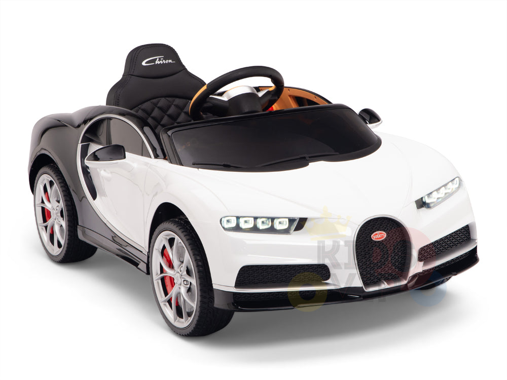 The White 12V Bugatti Chiron Kids Licensed 1 Seater Ride On Car features a detailed interior, steering wheel, rubber wheels with red brake calipers, and comes with a remote control. Its displayed against a plain white backdrop.