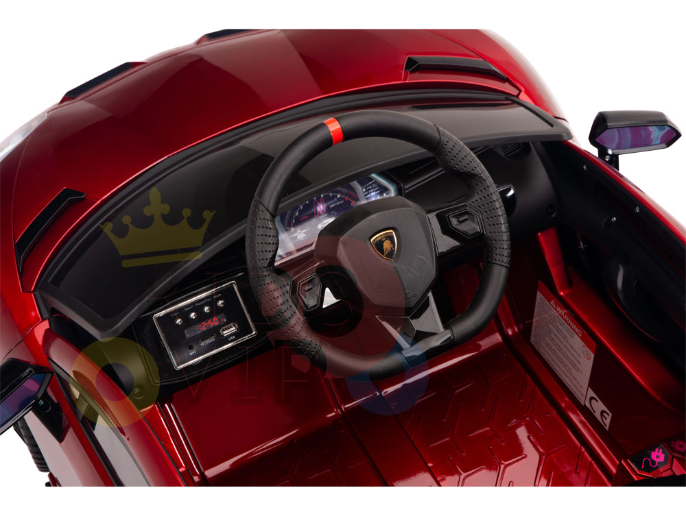 The Burgundy Red 12V Lamborghini SVJ Sport Kids licensed ride-on car offers a luxury sports car-like interior with a detailed steering wheel featuring the iconic logo, sophisticated dashboard controls, and sleek black accents. Perfect for young drivers eager to explore in style.