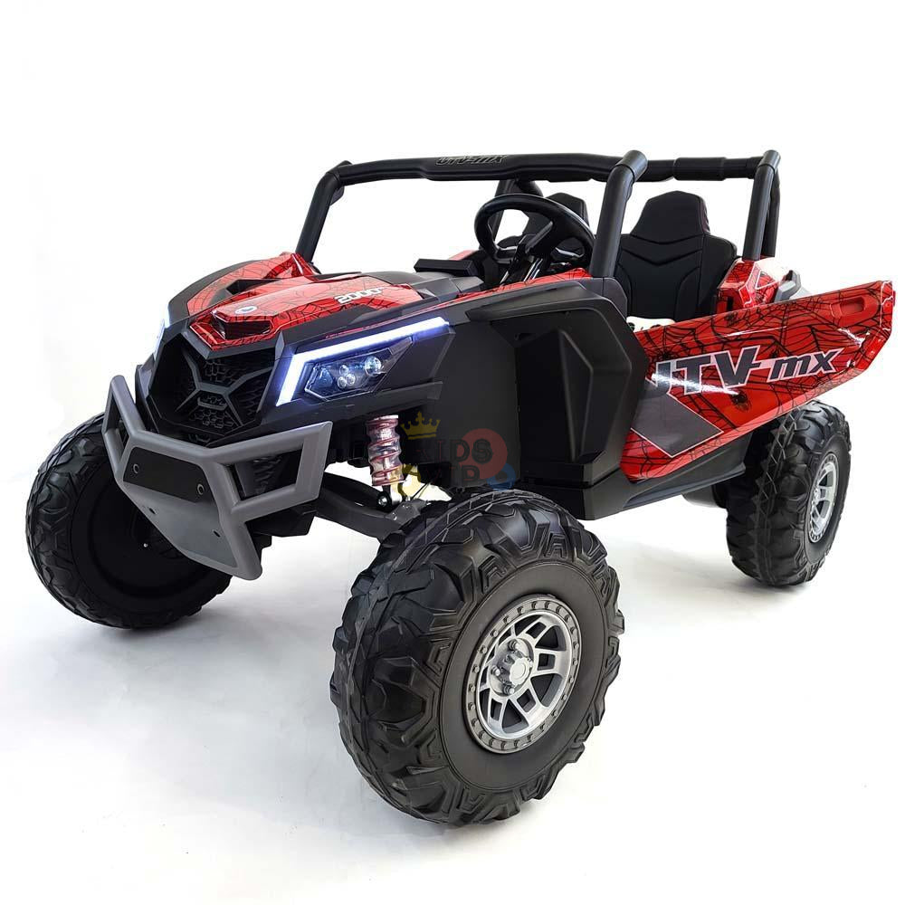 The Spyder Red XXL 2 Seats Challenger 24V MX Buggy MP4 Edition is a kids UTV with RC featuring rugged rubber wheels, a realistic red and black design, an MX decal, roll cage, headlights, and detailed grille reminiscent of a full-sized ATV.