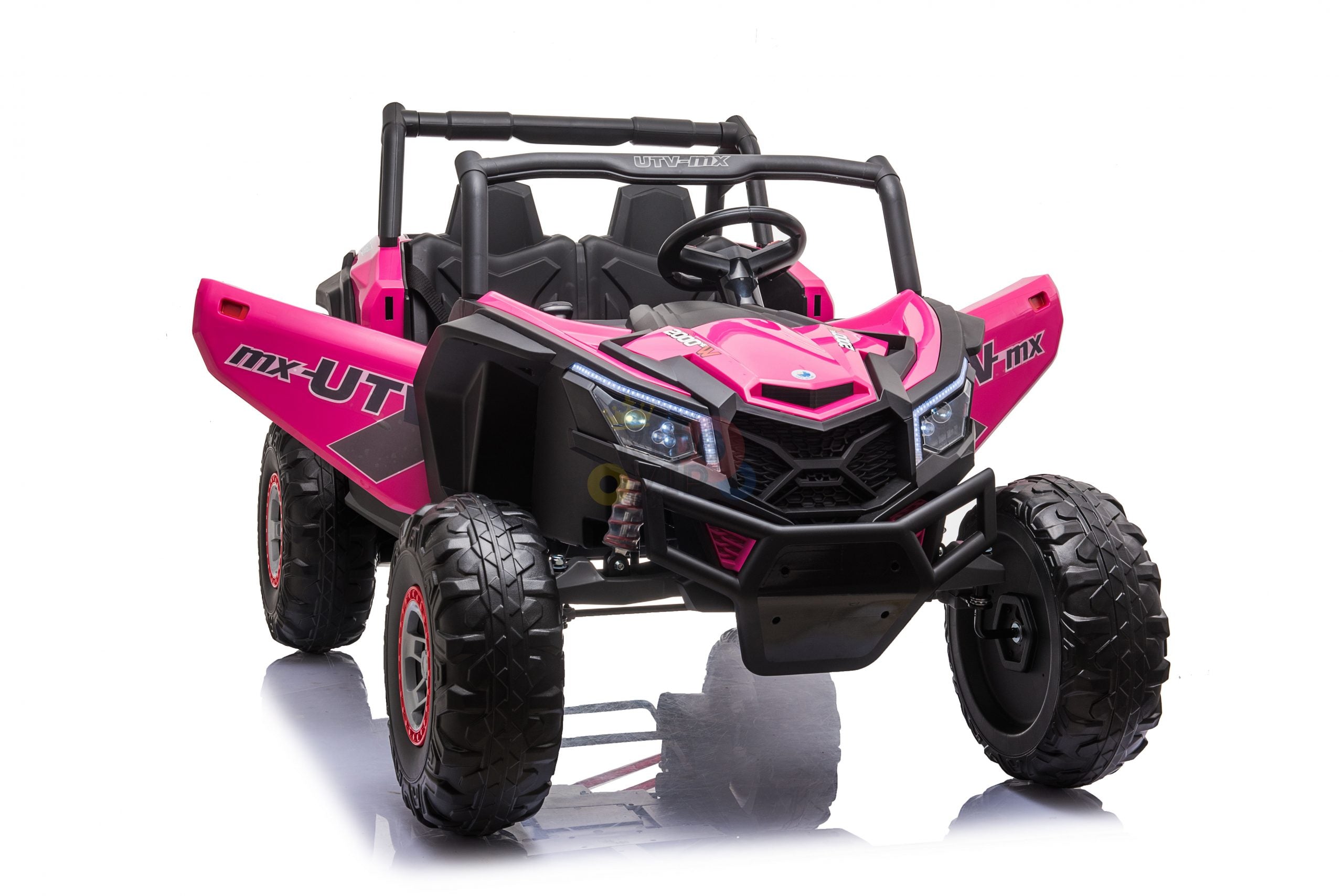 The Pink XXL 2 Seats Challenger MX Buggy 24V Edition is a kids ride-on car with black accents, featuring a steering wheel, detailed front headlights, sporty graphics, rugged rubber tires, and a roll bar in an off-road style.