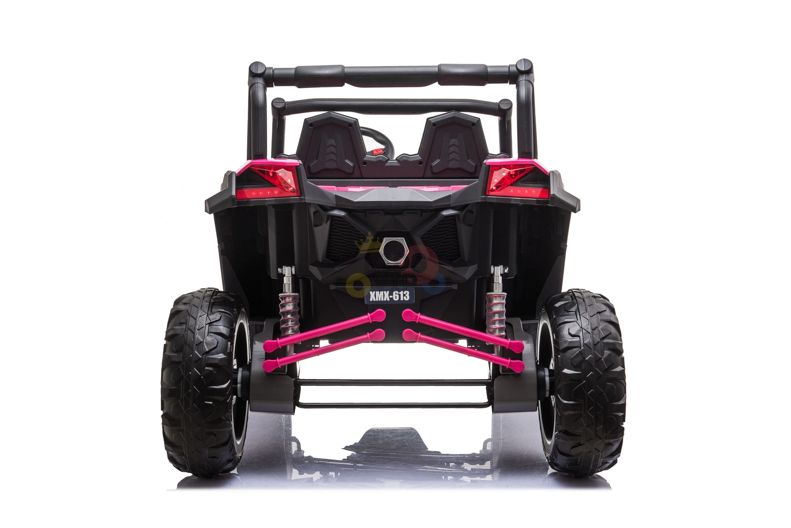 The rear view of the Pink XXL 2 Seats Challenger MX Buggy 24V Edition Kids Ride On Car shows its off-road style with black color and pink accents. It has large rubber wheels, visible shock absorbers, and a detailed undercarriage on a white background.