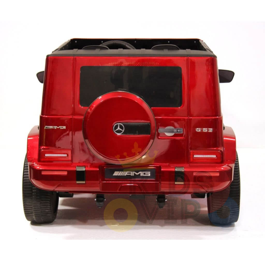 Red 24V Mercedes AMG G63 Kids Car, rear view, styled as toy SUV. Features spare tire on back door, detailed tail lights, AMG and G63 branding emblems. Prominent Mercedes logo above thick black wheels. Includes Parental Remote Control for safety. Special LED Edition with 2 seats and 4WD.