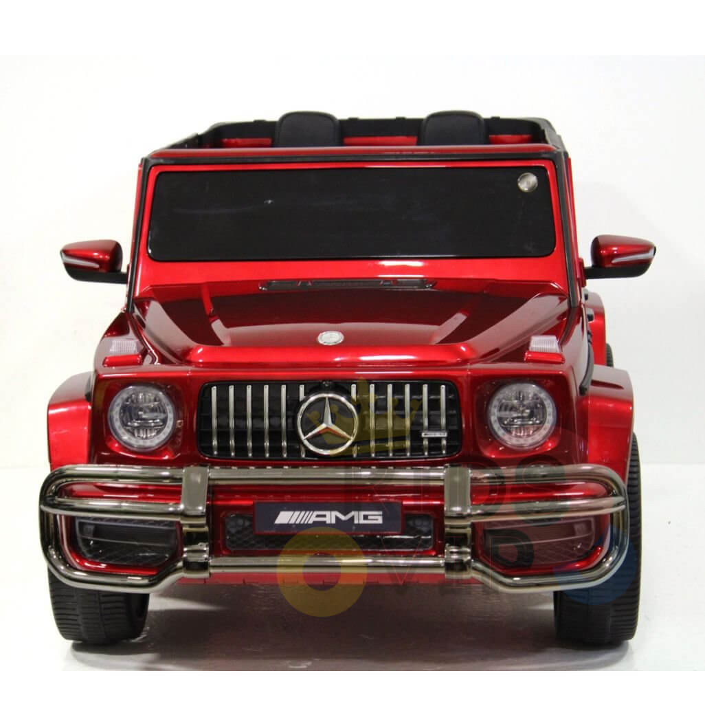This toy model, inspired by the Special LED Edition 2 Seats 4WD 24V Mercedes G Series Complete Kids Ride On w/RC, features a detailed front grille, headlights, and the iconic AMG logo. The miniature marvel is set against a plain white background.