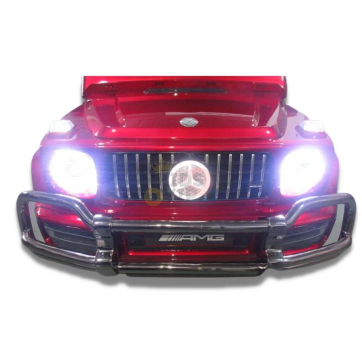 A front view of the Special LED Edition 2 Seats 4WD 24V Mercedes G Series Complete Kids Ride On shows its luxury design with an open hood, bright headlights over a grille with a circular logo, a bumper metal guard displaying the AMG emblem, and parental remote control for safety.
