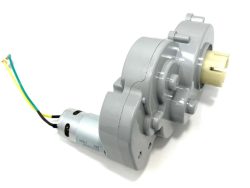 Gray plastic gearbox with attached electric motor for the 24V Audi Q5 Motor, optimized for ride-on cars. Features yellow, green, and black wires to boost speed and acceleration. The cylindrical gearbox exposes its gears and includes a yellow connector.