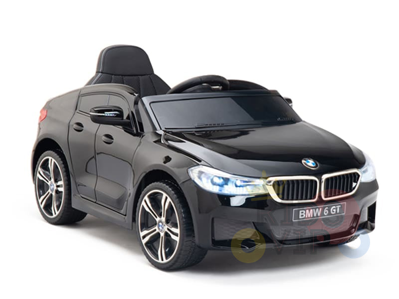 The Black Licensed BMW GT 12V Kids Ride On Power Car features a glossy finish, detailed headlights, steering wheel, and single seat, capturing the sleek design of the official electric kids ride-on BMW.