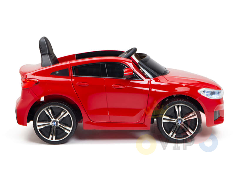 Red 12V BMW GT Kids Licensed Ride On Car, side view: features a sporty design, black interior, rubber wheels with silver rims, and realistic detailing.