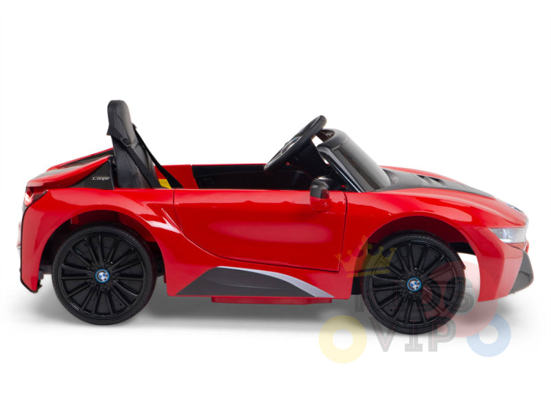 A small red Licensed BMW I8 12V Kids Ride On Power Car, featuring black wheels and a convertible top. Its sleek, aerodynamic design and prominent grille make it perfect for kids. The car stands out against a plain white background for an eye-catching display.