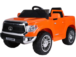 The Orange 12V Licensed Upgraded Toyota Tundra Kids Ride-On Truck with RC, featuring an orange body, black wheels, and steering wheel, has Tundra on the doors and license plate. Front headlights enhance this adventurous 1-seater fun!.