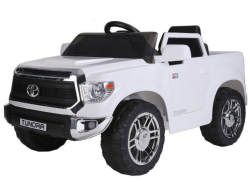 The White 12V Licensed Upgraded Toyota Tundra 1 Seater Kids Ride On Truck with RC features large wheels, a detailed grille, and side mirrors, providing children an adventurous ride in their own miniature pickup truck.