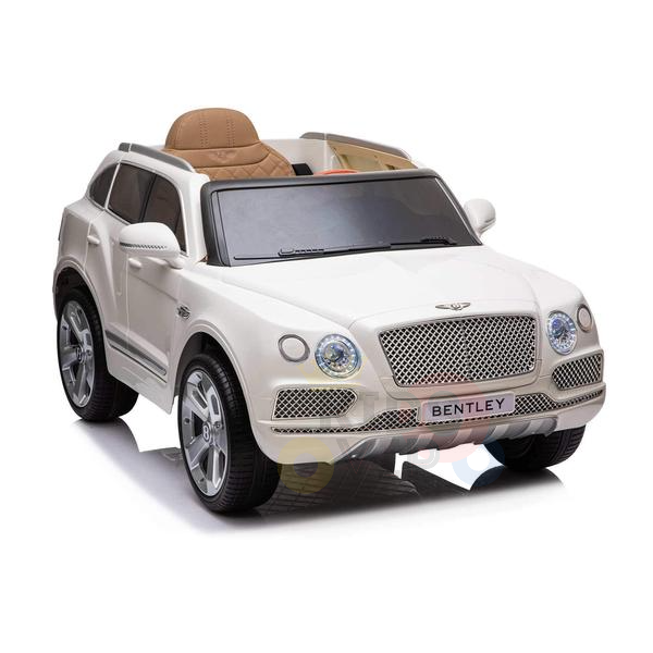 The White 12V Bentley Bentayga Kids Licensed 1-Seater Ride On Car features a detailed front grille, headlights, and logo. With tan seats and silver wheels, this remote-controlled toy offers kids the thrill of driving a luxurious Bentley SUV replica.