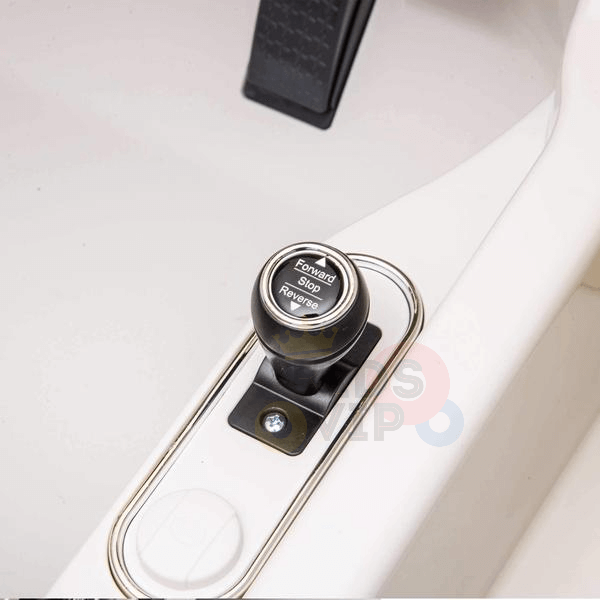 A close-up of a lever labeled Forward, Stop, and Reverse within the interior of the White 12V Bentley Bentayaga Kids Licensed 1 Seater Ride On Car, set in a white panel with a black pedal visible in the background.