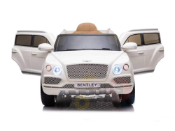 A White 12V Bentley Bentayga Kids Licensed Ride On Car, featuring rubber wheels and a remote, showcases open front doors, a detailed grille, and headlights against a plain white background.