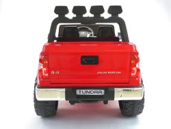 A Red 12v Licensed Toyota Tundra Kids Ride On Truck, labeled TUNDRA and 4x4, is set against a white background. This 2 Seater RC model features black roll bars with lights and a visible steering wheel, offering an adventurous ride.