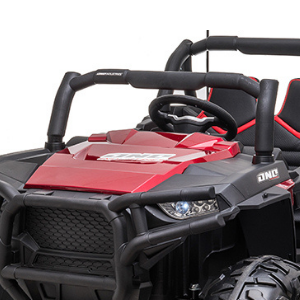 The Red - Real Paint 2 Seats UTV Adventure Complete Edition 24V Kids Ride On features a rugged design with a roll bar, spotlights, detailed steering wheel, large tires, and a comfortable leather seat. It includes a parental remote for safety while blending style with luxury in its off-road vehicle design.