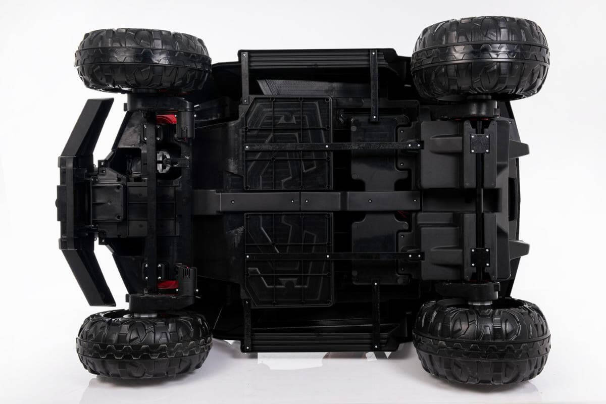 The image shows the underside of the 4X4 Edition 24V Viper Kids Ride on Buggy/UTV with RC, highlighting its black chassis, four rugged rubber wheels, and detailed components against a white background.