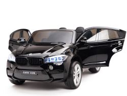 The Black 12V Licensed XXL BMW X6 Ride-On Car features realistic details like opening doors, front lights, and a BMW X6M license plate. This 2-seater boasts a sleek design and remote control for an exciting driving experience for young enthusiasts.
