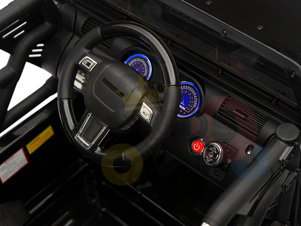 Close-up of the 4X4 Big Wheels EVA Edition 12v Kids Ride-on Truck dashboard shows a black steering wheel, illuminated gauges, and buttons like a red power button. Detailed controls enhance realism, making it feel just like the real thing.