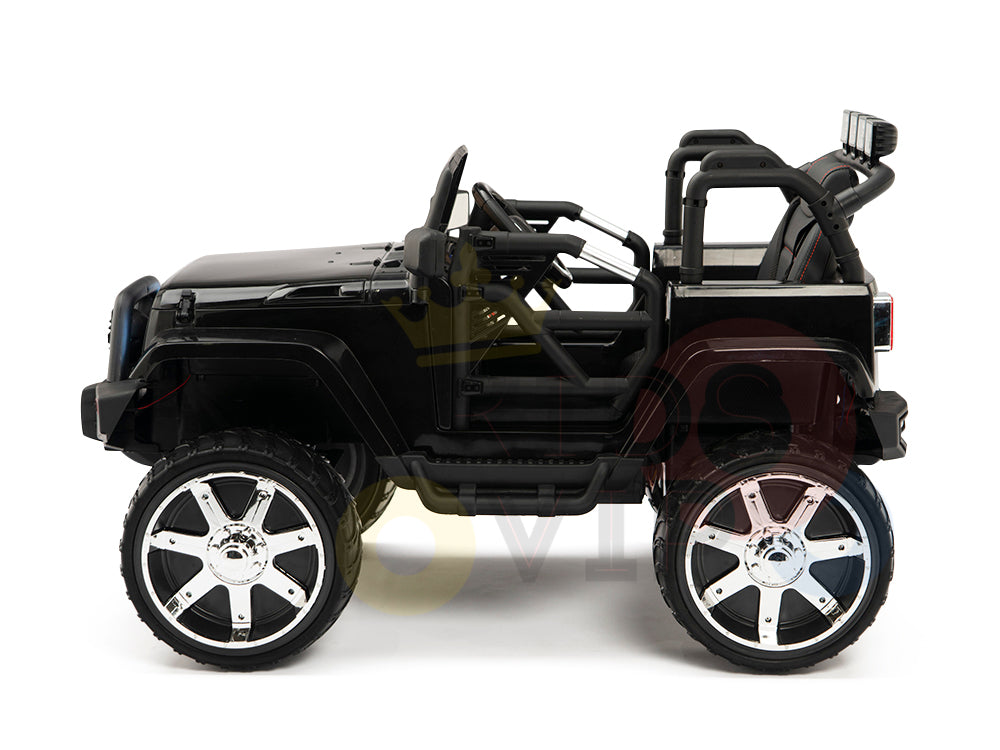 Side view of the 4X4 Big Wheels EVA Edition, a sleek black 12v ride-on truck with oversized chrome wheels and open-frame design. This off-road vehicle includes upgraded features such as a steering wheel, seat, and remote control for adventurous fun for children.
