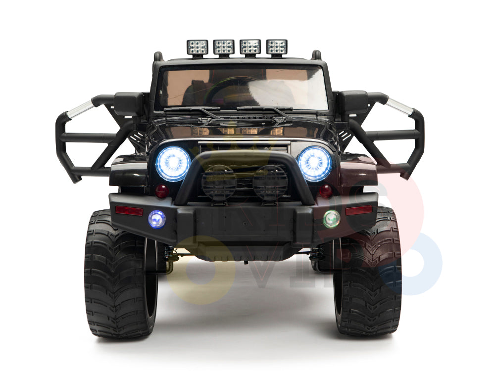 The 4X4 Big Wheels EVA Edition features a black 12v ride-on truck with large tires, LED roof lights, and a rugged bumper. The headlights and bumper lights shine brightly, while the remote control ensures easy navigation over tough terrains for kids and toddlers.