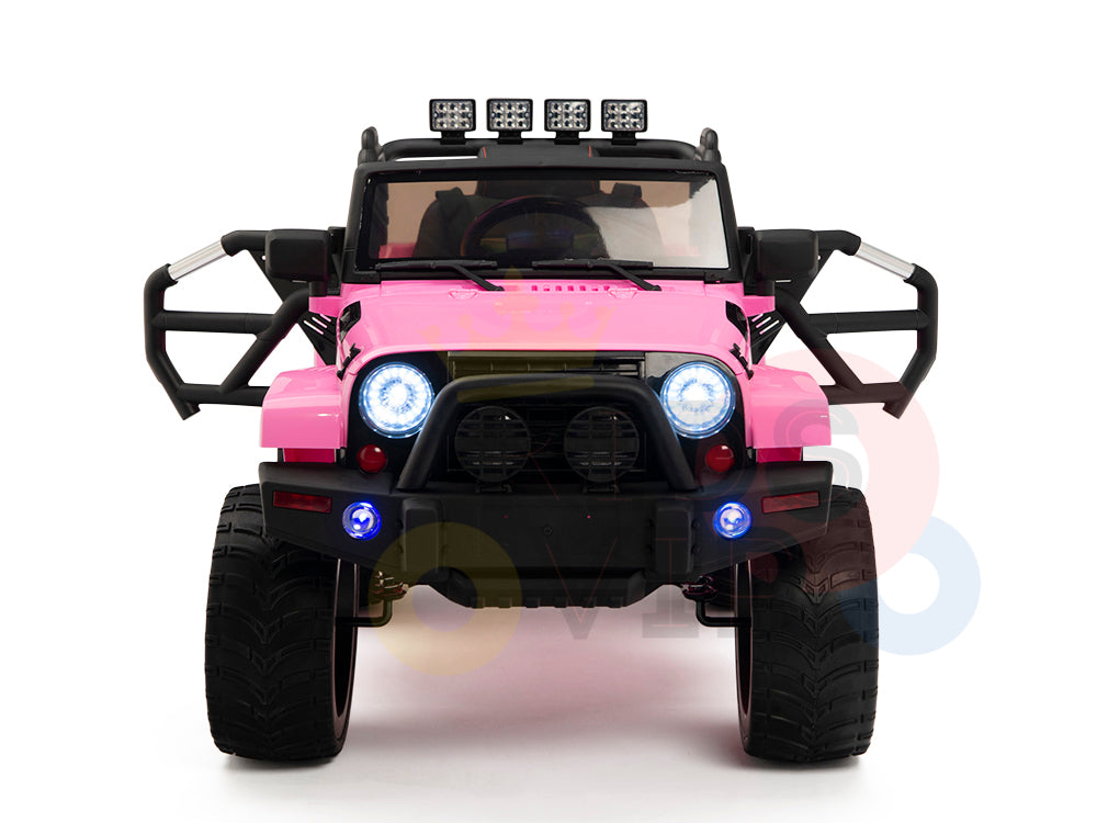 The 4X4 Big Wheels EVA Edition 12v Kids and Toddlers Ride-On Truck features blue headlights, roof lights, large tires, extended side mirrors, and a parental remote control for safety. The pink truck is displayed front view on a crisp white background.