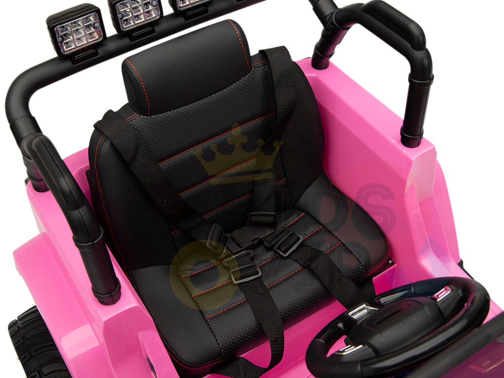 The 4X4 Big Wheels EVA Edition 12V Kids Ride-On Truck features a pink seat with plush black and red-stitched cushions, a safety harness, four LED lights on the backrest, and a right-positioned steering wheel. Its adventure-ready with an optional parental remote control.