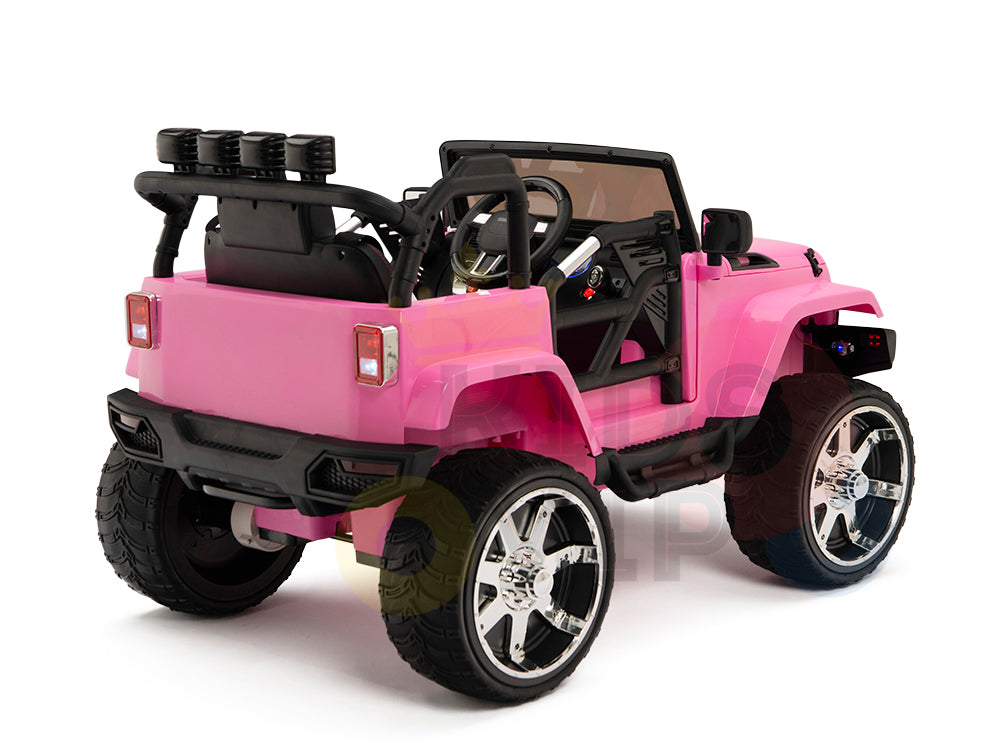 A 4X4 Big Wheels EVA Edition 12v ride-on truck, shown from the back and side, in pink with large wheels, black roll cage, and detailed interior. It includes realistic seats, a steering wheel, and headlights.