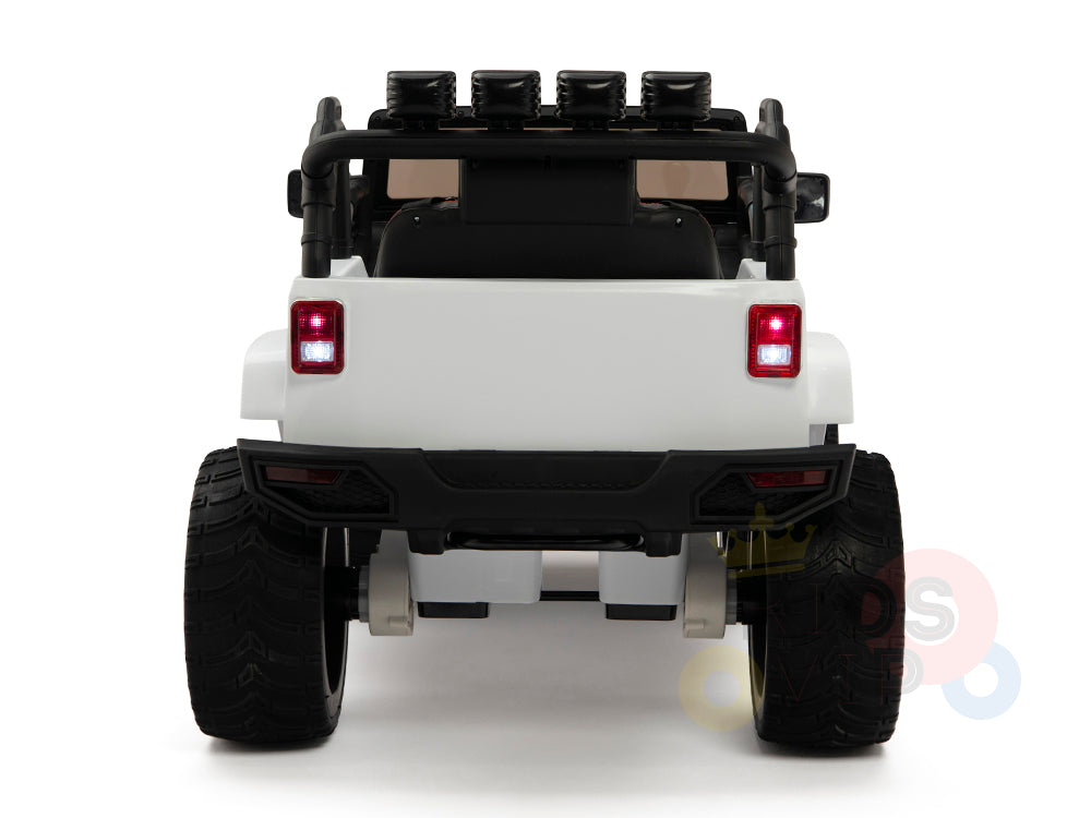 View of the 4X4 Big Wheels EVA Edition, a white toy off-road vehicle for kids, featuring large black wheels and four top-mounted spotlights. It includes red tail lights and a black roll bar, set against a plain white backdrop.