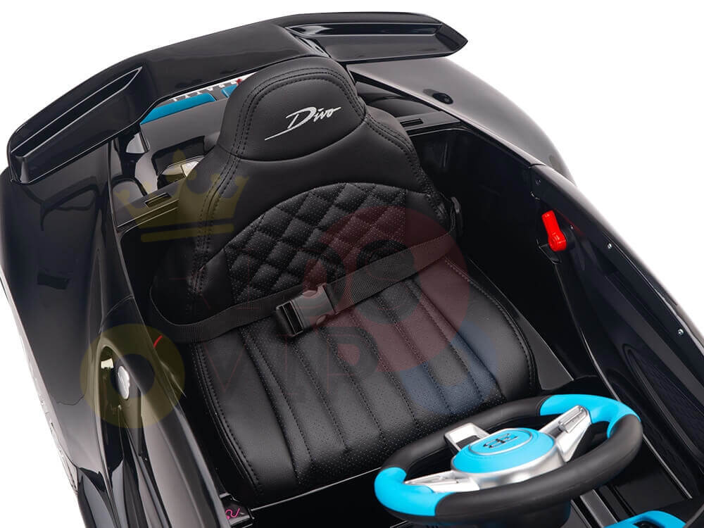 The 12V Bugatti Divo ride-on car offers a luxurious black interior, quilted Divo seats, a black seatbelt, teal and black steering wheel with blue accents, a red gear shift, and sleek dashboard with striking blue details. Enhance performance with the 12V Bugatti Divo rear wheel upgrade today!.