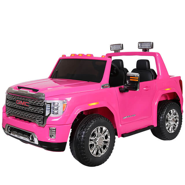 The bright pink ride-on GMC Sierra for kids features black Eco Leather seats, chrome wheels, side mirrors, a detailed front grille, headlights, and roof lights in an open-top design.