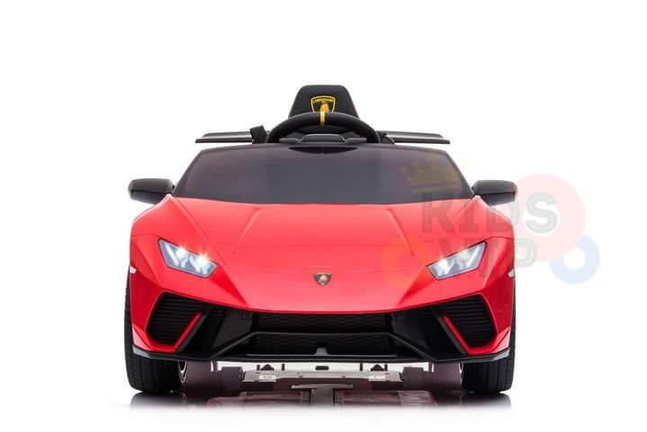 The Officially Licensed 12V Lamborghini Huracan Sports Edition Ride-on Car features a red body, black steering wheel, angular headlights, streamlined design, and front logo. A 12V battery ensures long-lasting fun on a plain white background.