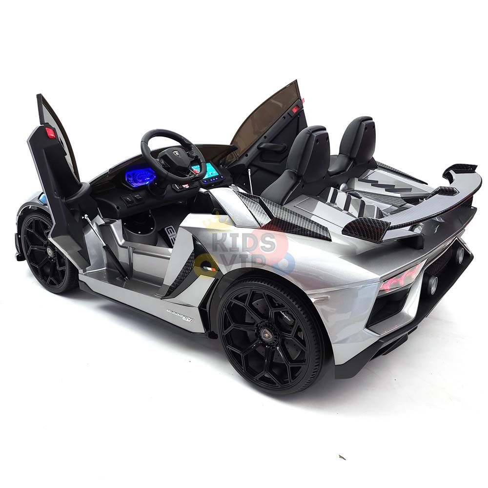Upgrade Your Ride with the Complete Edition 24V Lamborghini Sport Car—a gray, two-seater toy car for kids featuring a detailed dashboard, black wheels, and upward-opening doors. Includes a KidsVip Warranty for peace of mind.