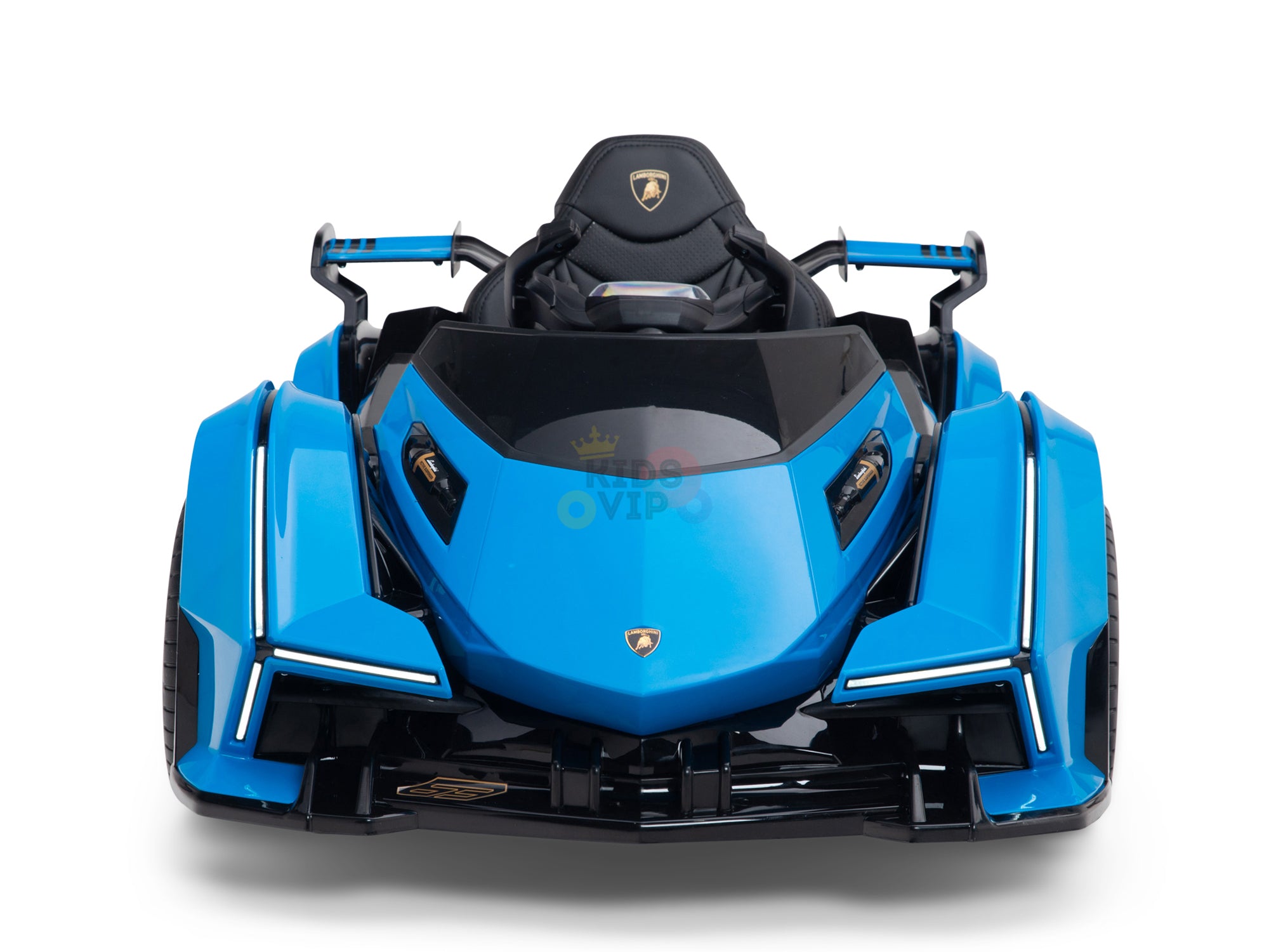 The Blue Official Complete Edition 12V Lamborghini Vision GT Kids Ride-on Car has a sleek design with angular shapes, LED lights, an eco leather seat, detailed dashboard, and a badge reminiscent of a luxury car brand.