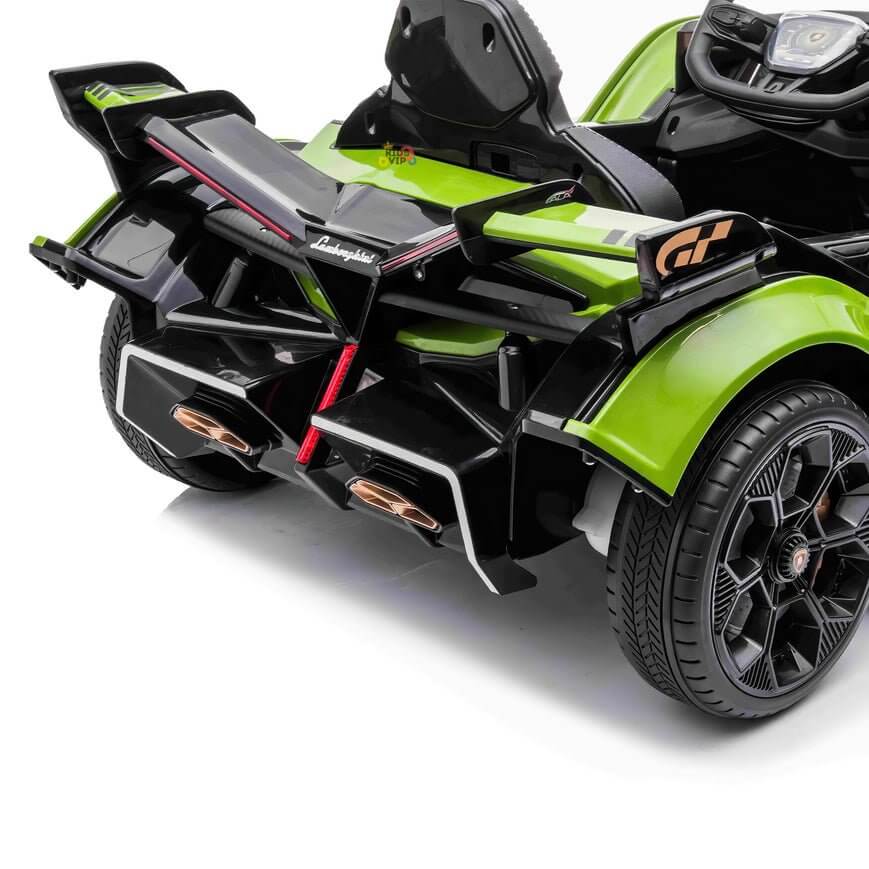 The Green 12V Official Lamborghini Vision GT Kids Ride-on Car features black and red accents, realistic wheels, rear exhausts, a simplistic dashboard visible from the side, and offers an authentic driving experience.
